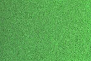 Green background pattern and texture of colored felt board. photo