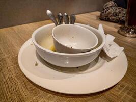 piles of plates and bowls of leftover food photo