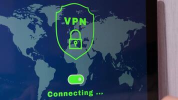Laptop App screen of VPN creation Internet protocols for protection private network Virtual private network anonymous safe and secure internet access on workplace background with coffee pen and notebook. Future technologies video
