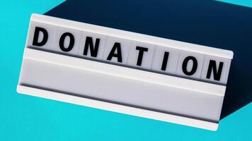 Zoom in out Lightbox with text DONATION Motivational Words Quotes Concept. Colorful yellow background. Minimalistic creative concept. Donation support video
