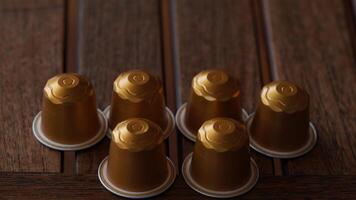 a group of six golden coffee cups sitting on a table photo