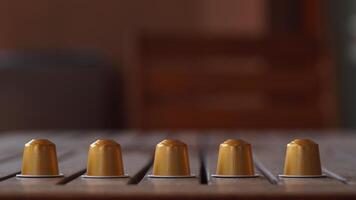 a row of coffee capsules on a table photo