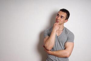 young man contemplating an idea photo