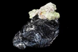 Macro stone Hyalite mineral, tourmaline Sherl, smoky quartz on a black background photo