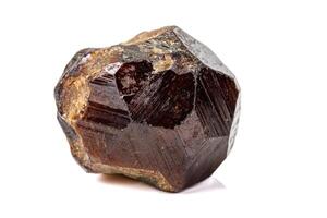 Macro stone Grossular mineral on white background photo