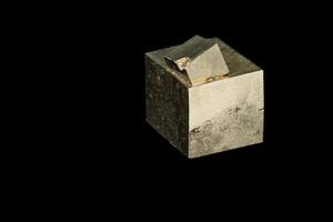 Macro mineral stone Pyrite on a black background photo