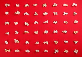 popcorn macro on a red background photo