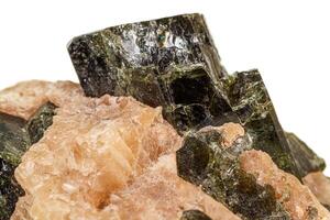 Macro of a mineral stone Vesuvianite on a white background photo