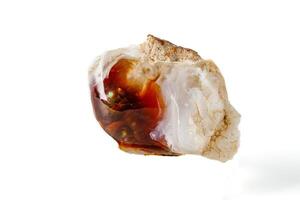 Macro mineral stone fiery Agate on a white background photo