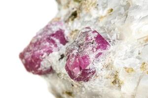 Macro mineral stone Ruby in rock on white background photo