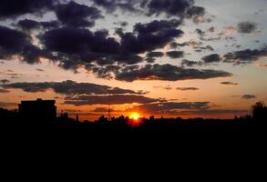 Autumn red sunset with a purple sky photo