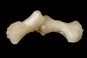 Macro of a stone Stilbite mineral on a black background photo