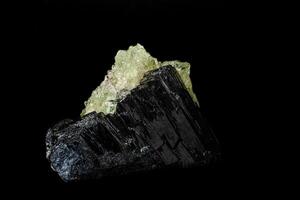 Macro stone Hyalite mineral, tourmaline Sherl, smoky quartz on a black background photo