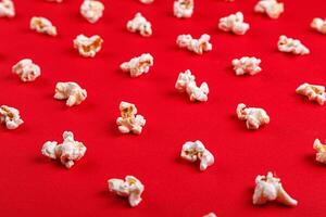 popcorn macro on a red background photo