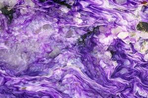 Macro stone Charoite mineral on white background photo