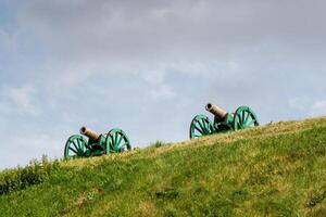 The ancient guns stand on the mountain photo