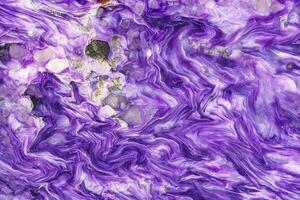 Macro stone Charoite mineral on white background photo