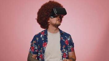 Man using virtual reality futuristic technology VR headset helmet to play simulation 3D game photo