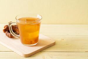 Delicious sweet drink tamarind juice and ice cube photo