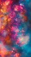Colorful and blurred bokeh light effect background ideal for mobile wallpaper photo