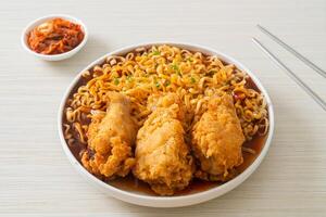 Korean instant noodles with fried chicken or Fried chicken ramyeon photo