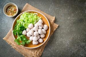 pork meatball with vegetable and spicy sauce photo