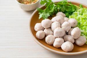 pork meatball with vegetable and spicy sauce photo