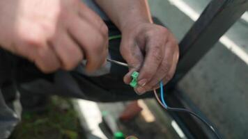 Electrician installs wiring using Connectors for connecting wires in automation and electronics equipment. Connection of electrical wires of electrical appliances video
