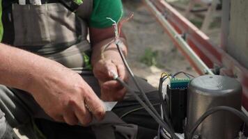 Electrician installs wiring using Connectors for connecting wires in automation and electronics equipment. Connection of electrical wires of electrical appliances video