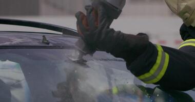 A skilled team of firefighters employs specialized tools and quick reactions to successfully extricate a person trapped in a car, showcasing their heroism and precision in a high-stakes rescue video