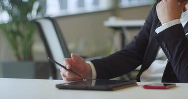 A suited director in a business office employs a pen to contemplate new business ventures, exemplifying strategic thinking and decision-making in the corporate world video