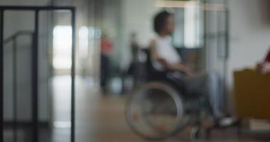African American businessman in a wheelchair engages in a professional discussion with his colleague, addressing various business challenges and exploring solutions in an inclusive and diverse modern video