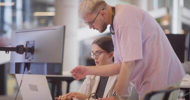 A diverse group of colleagues collaborates in modern offices, showcasing their collective problem-solving skills and innovative approach to address a variety of business challenges. video