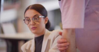 A diverse group of colleagues collaborates in modern offices, showcasing their collective problem-solving skills and innovative approach to address a variety of business challenges. video