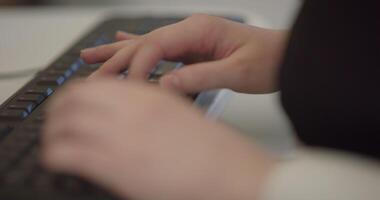 Close up of freelancer's developer hands typing program code on laptop keyboard in coworking. Businessman at work in working in office. Copywriter writing text on computer keyboard in coffeeshop. video
