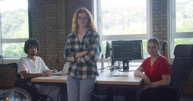 A diverse group of business colleagues engage in discussions about various business challenges, surrounded by their coworkers in a modern startup office, showcasing teamwork, innovation, and problem video