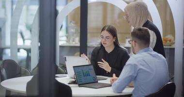 A diverse group of colleagues collaboratively and efficiently tackles various business tasks in a modern office, exemplifying teamwork, productivity, and a dynamic corporate environment. video