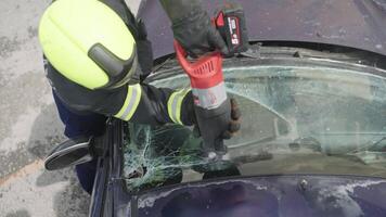 A skilled team of firefighters employs specialized tools and quick reactions to successfully extricate a person trapped in a car, showcasing their heroism and precision in a high-stakes rescue video