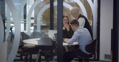 A diverse group of colleagues collaboratively and efficiently tackles various business tasks in a modern office, exemplifying teamwork, productivity, and a dynamic corporate environment. video