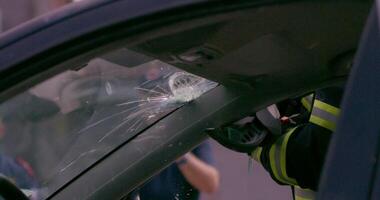A skilled team of firefighters employs specialized tools and quick reactions to successfully extricate a person trapped in a car, showcasing their heroism and precision in a high-stakes rescue video