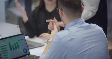 Group of business people brainstorming together in a startup space, discussing business projects, investments, and solving challenges. video