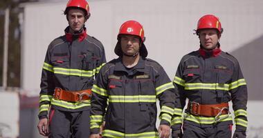 A specialized firefighting unit equipped with special attire and advanced equipment embarks on a hazardous fire suppression mission, showcasing their professionalism and readiness to combat fires in video