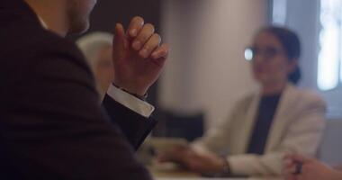 A diverse group of entrepreneurs engages in a dynamic business meeting within a modern office, showcasing their collaborative spirit and innovative approach to business development video