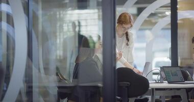 A diverse group of colleagues collaboratively and efficiently tackles various business tasks in a modern office, exemplifying teamwork, productivity, and a dynamic corporate environment. video