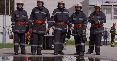 A specialized firefighting unit equipped with special attire and advanced equipment embarks on a hazardous fire suppression mission, showcasing their professionalism and readiness to combat fires in video