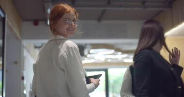 A diverse group of colleagues collaboratively and efficiently tackles various business tasks in a modern office, exemplifying teamwork, productivity, and a dynamic corporate environment. video