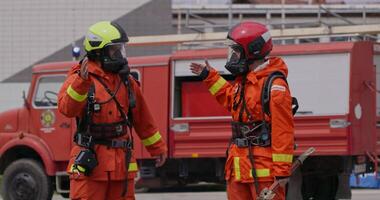 A team of firefighters comes together to celebrate and share their joy and relief after a successful operation, demonstrating the strong bond and camaraderie among these heroic individuals video