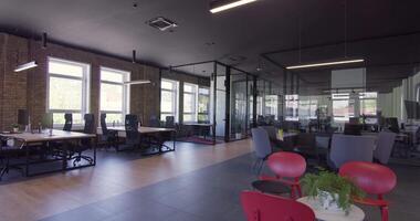 Modern startup centers composed of glass offices within a contemporary corporate environment, highlighting the sleek, innovative, and minimalist design aesthetics of a cutting-edge workspace video