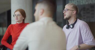 A diverse group of entrepreneurs engages in a dynamic business meeting within a modern office, showcasing their collaborative spirit and innovative approach to business development video