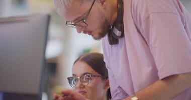 A diverse group of colleagues collaborates in modern offices, showcasing their collective problem-solving skills and innovative approach to address a variety of business challenges. video